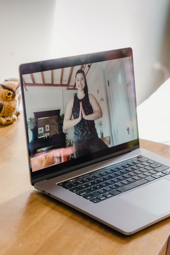 Woman doing online yoga class